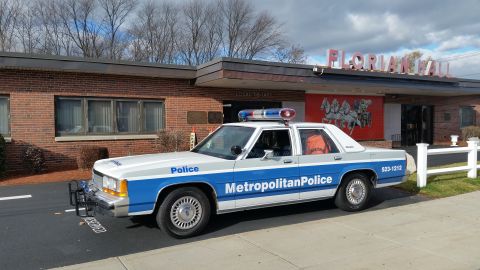 1991 Ford LTD Crown Victoria - Photo of a Metropolitan Police Crown Victoria cruiser parked in a lot, not a technical document.