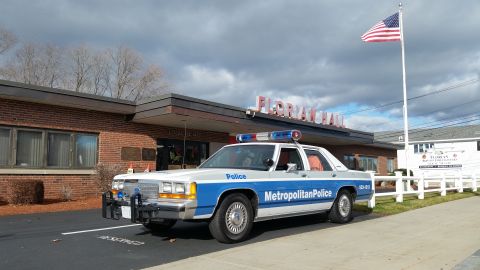 1991 Ford LTD Crown Victoria - Photo of a Metropolitan Police Crown Victoria police car parked in a lot, not a technical document.