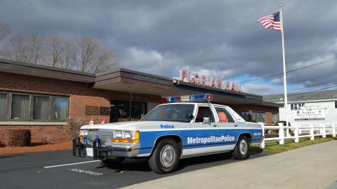 1991 Ford LTD Crown Victoria - Photo of a blue-and-white Metropolitan Police Crown Victoria cruiser, not a technical document.