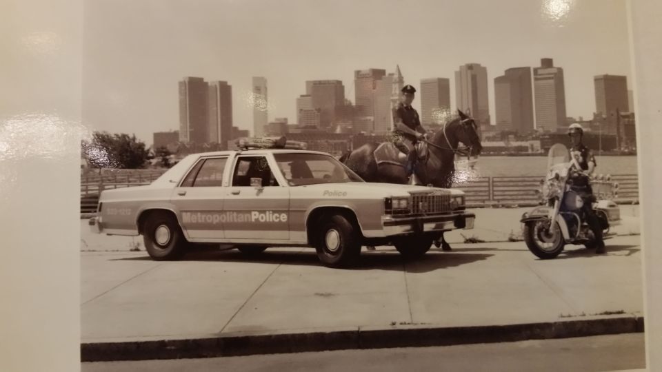 Vintage photo of a Metropolitan Police car, horse-mounted officer, and motorcycle officer