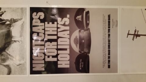 1991 Ford LTD Crown Victoria - Metropolitan Police public-service ad poster reading Nightcaps for the Holidays warning against drinking and driving.