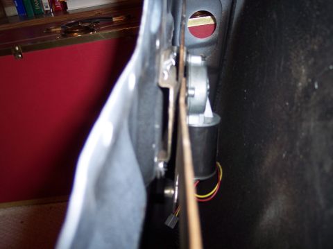 1990 Ford Bronco - Close-up view of a door window regulator motor and its associated wiring.