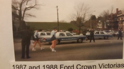 1991 Ford LTD Crown Victoria - Photo of 1987 and 1988 Ford Crown Victoria Metropolitan Police cruisers at a parade, not a technical document.