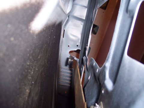1990 Ford Bronco - Detail shot of the inner door jamb structure, possibly during repair or modification.