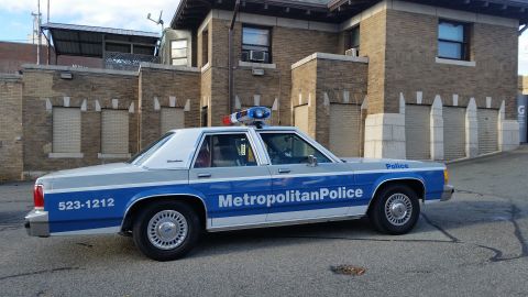 1991 Ford LTD Crown Victoria - Photograph of a Metropolitan Police Ford Crown Victoria patrol car, not a technical document.
