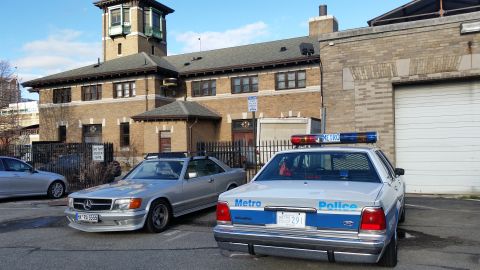 1991 Ford LTD Crown Victoria - Photograph of a Metropolitan Police Ford Crown Victoria patrol car in a parking lot, not a technical document.