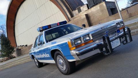 1991 Ford LTD Crown Victoria - A 1991 Ford Crown Victoria police car is seen from a three-quarter front view, parked outdoors.