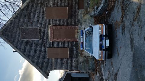 1991 Ford LTD Crown Victoria - 1991 Ford Crown Victoria police car parked outside an abandoned-looking building.