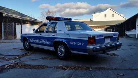 1991 Ford LTD Crown Victoria - Metropolitan Police Crown Victoria, model year 1991, seen from the rear.