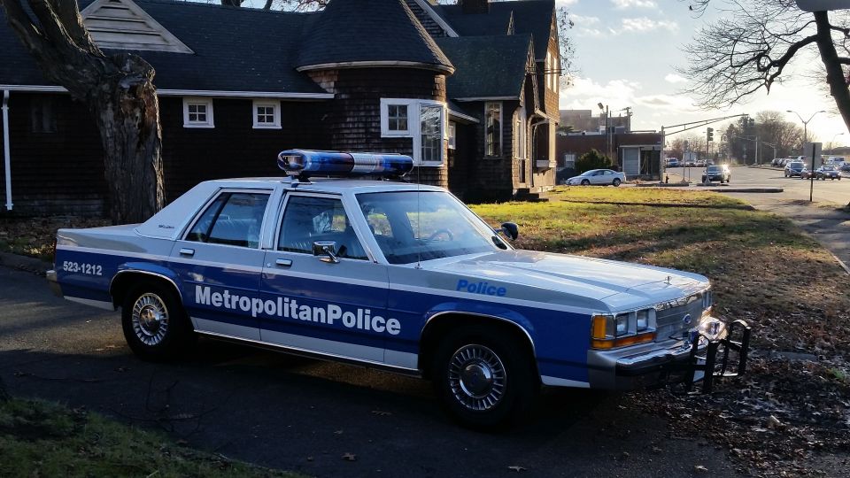 1991 Ford Crown Victoria police car, front quarter view, blue and white