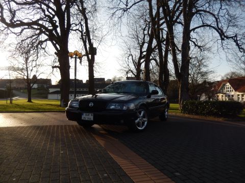 2003 Mercury Marauder - A black 2003 Mercury Marauder is parked outdoors on a sunny day.