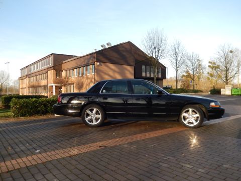 2003 Mercury Marauder - Black 2003 Mercury Marauder parked outside a brick building on a sunny day.