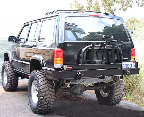 1990 Ford Bronco - This modified Jeep Cherokee XJ features aggressive off-road tires and a heavy-duty rear bumper assembly.