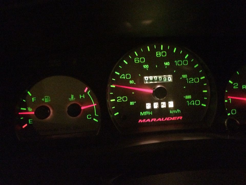 Dashboard gauges show 99,990 miles. Speedometer reads 40 MPH. Fuel and temperature gauges visible