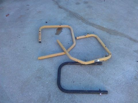 1994 Ford Bronco - Ladder rack components are laid out on a concrete surface.