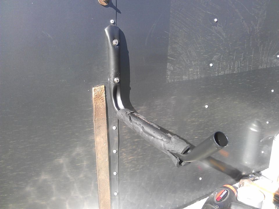 Ladder rack part attached to dark metal wall