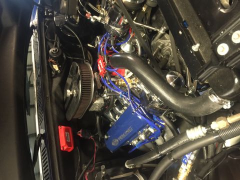 1982 Ford Bronco - Close-up view of a modified engine bay, custom valve covers and wiring.