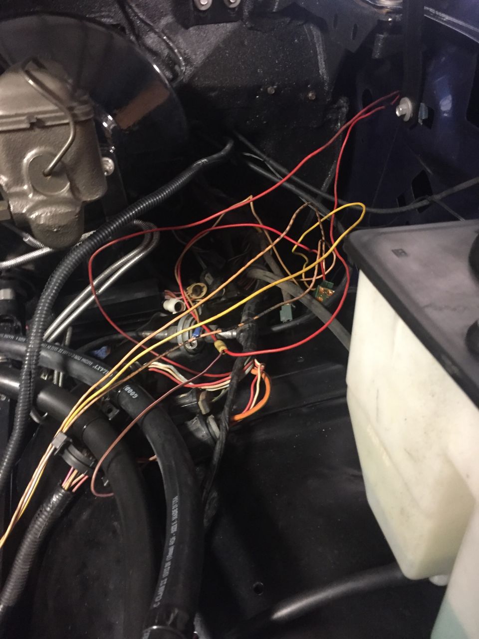 1982 Ford Bronco engine bay wiring harness and hoses.