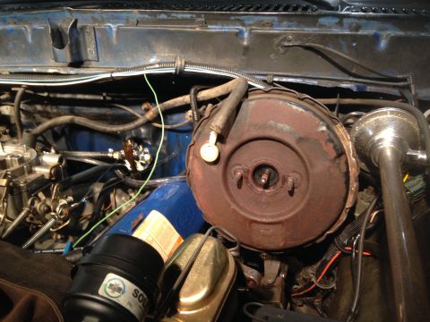 1979 Ford Bronco - This is a close-up, high-angle view of the engine bay of a 1979 Ford Bronco, nicknamed "Black Betty." The image focuses on the brake booste…