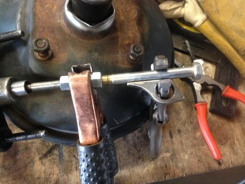 1979 Ford Bronco - Automotive brake drum assembly with tools, likely during a repair or modification.