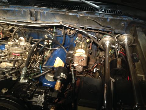 1979 Ford Bronco - Engine bay view showing a dual horn setup and an Edelbrock carburetor, likely part of a hydroboost conversion.