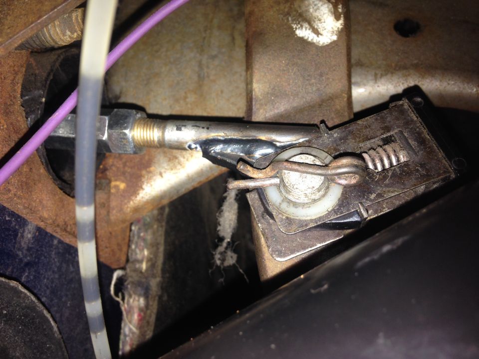 Hydroboost conversion linkage with a clevis pin and spring mechanism