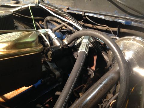 1979 Ford Bronco - Close-up of engine bay components including brake fluid reservoir and hoses.