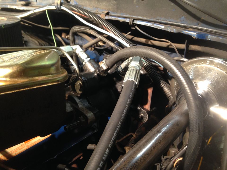 Engine bay view showing brake fluid reservoir, master cylinder, and hydraulic lines
