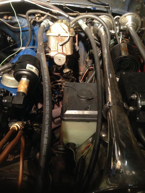1979 Ford Bronco - Close-up view of the engine bay, focusing on the hydroboost brake system components and associated plumbing.