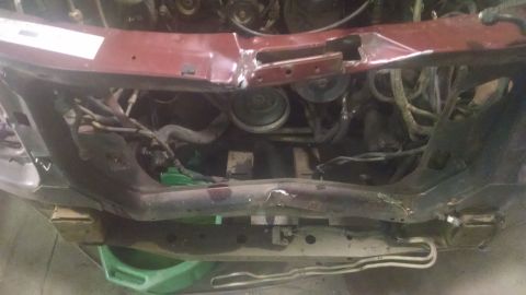 2000 Chevrolet Astro - Close-up view of a vehicle's engine bay, showing mechanical parts and wiring.