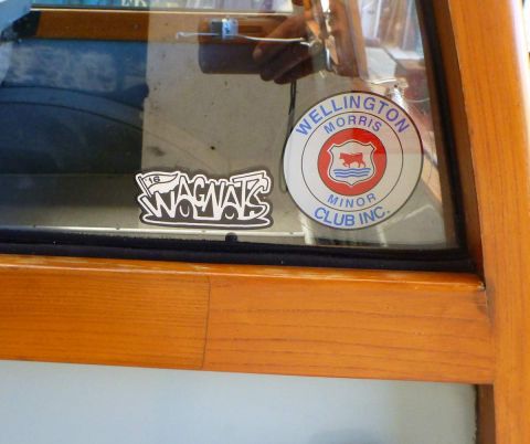 1969 MINI Cooper - Stickers adorn the window of a vehicle, one indicating membership in the Wellington Morris Minor Club.