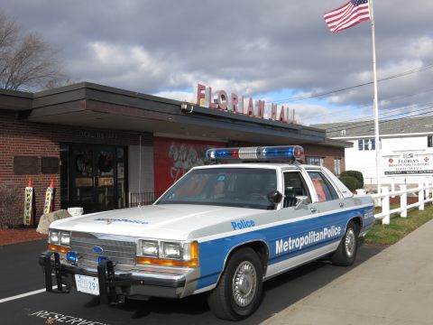 1991 Ford LTD Crown Victoria - Photo of a blue and white Metropolitan Police Crown Victoria parked at Florian Hall.