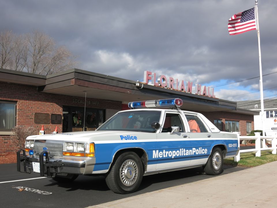Front three-quarter view of Metropolitan Police Crown Victoria at Florian Hall