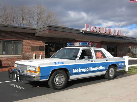 1991 Ford LTD Crown Victoria - Photo of a blue and white Metropolitan Police Crown Victoria parked at Florian Hall.