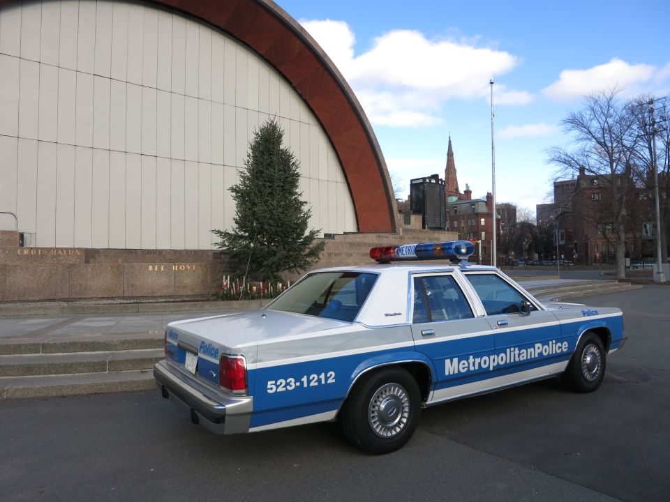 Rear view of a blue and white Metropolitan Police Crown Victoria with 523-1212 markings
