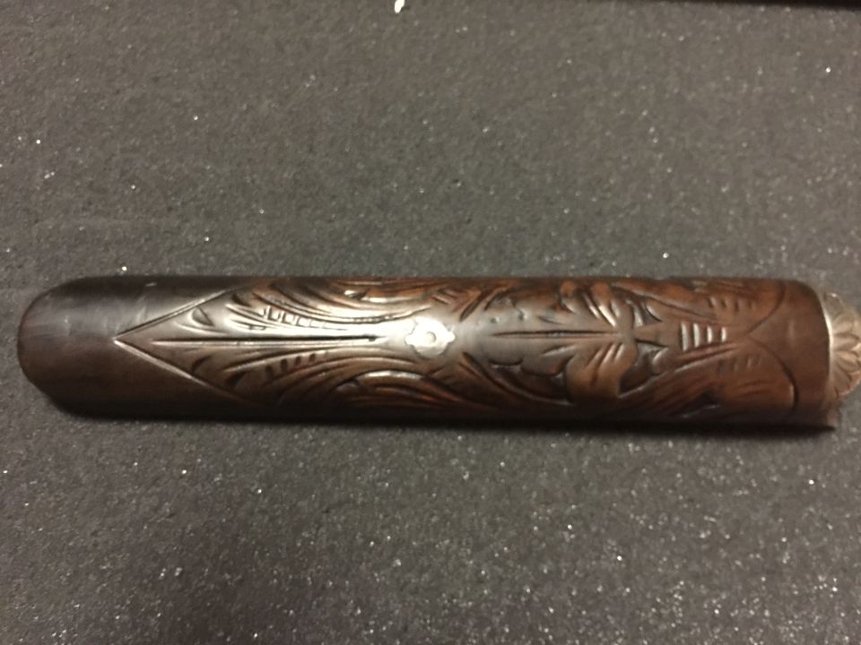 Carved wooden part with leaf and floral patterns