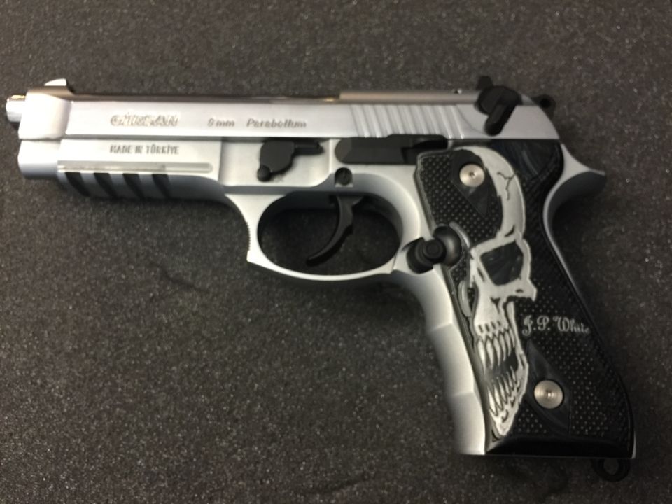 Silver handgun with skull grip, "MADE IN TURKIYE", "9mm Parabellum"