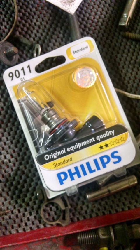 2000 Chevrolet Astro - A Philips 9011 Standard headlight bulb is displayed in its original packaging. The packaging is white and yellow and features the Philips l…