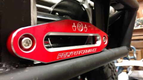 1967 Ford F-250 - Red winch fairlead with "POLYPERFORMANCE" text and graphics.