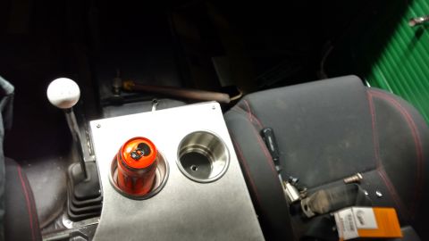 1967 Ford F-250 - Interior view of a truck, showing a manual transmission shifter and a custom cup holder with a soda can.