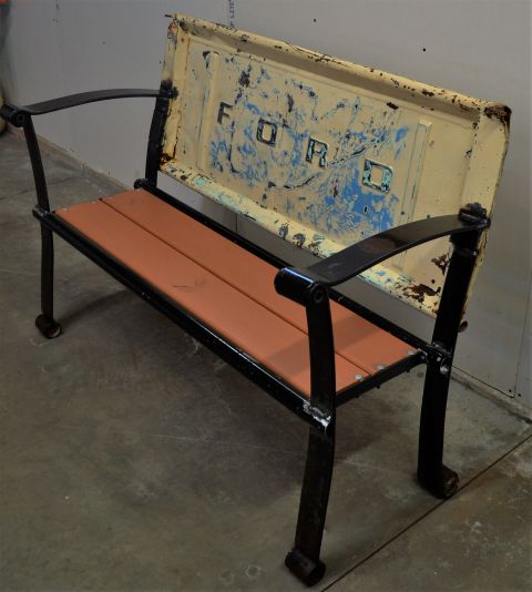1994 Ford Bronco - This unique bench features a repurposed Ford tailgate as its backrest, the iconic brand's lettering.