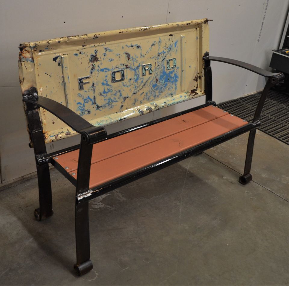 Bench made from a Ford tailgate with wooden seat and metal frame