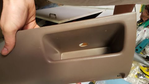 1996 Ford Bronco - Interior trim piece, possibly from a vehicle's dashboard or door panel.