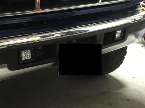 1996 Ford Bronco - Aftermarket LED fog lights installed on the front bumper of a 1996 Ford Bronco.
