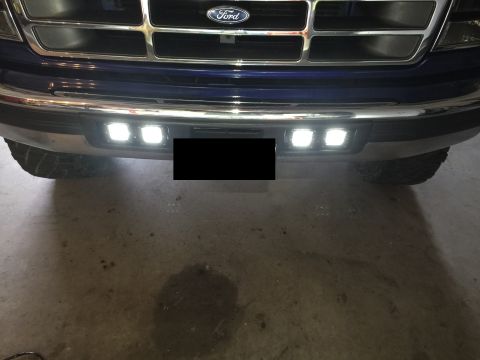 1996 Ford Bronco - This Ford truck features a chrome bumper with newly installed LED fog lights, enhancing its front-end appearance.