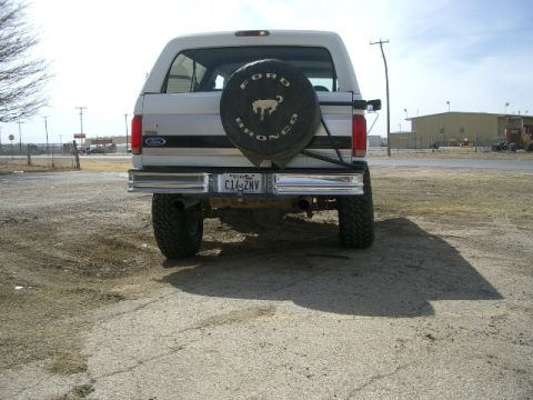 1994 Ford Bronco - This Ford Bronco has a spare tire mounted on the rear door and a lifted suspension.