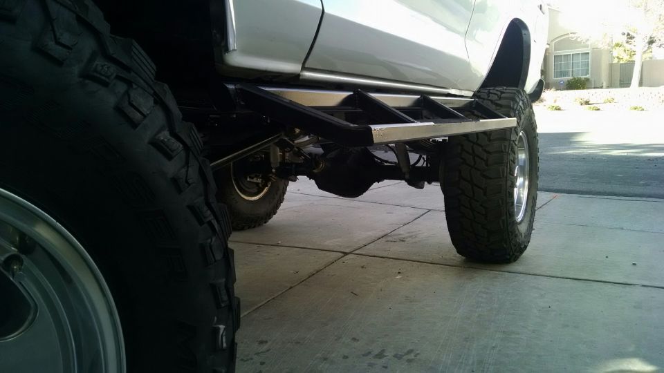 1979 Ford Bronco side view showing large off-road tires and custom rock sliders
