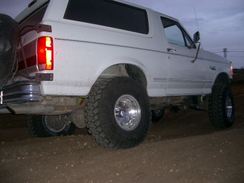 1994 Ford Bronco - Rear view of a lifted 1994 Ford Bronco with oversized tires.