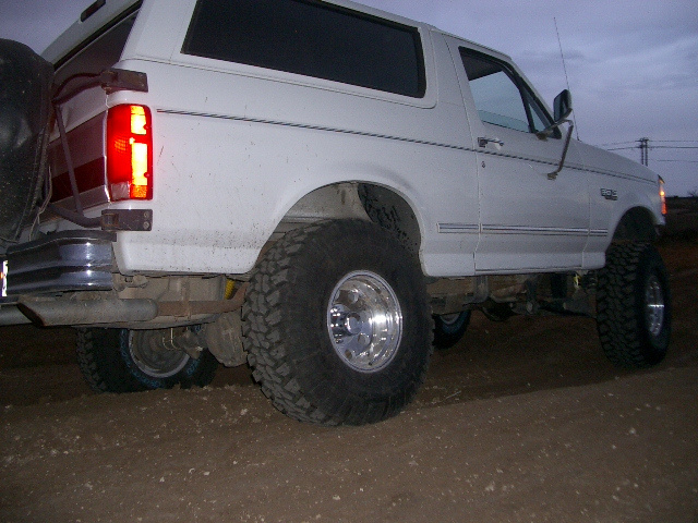 1994 Ford Bronco rear 3/4 view, lifted with large off-road tires