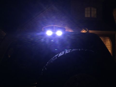 1996 Ford Bronco - Aftermarket LED third brake light installed on a vehicle at night.
